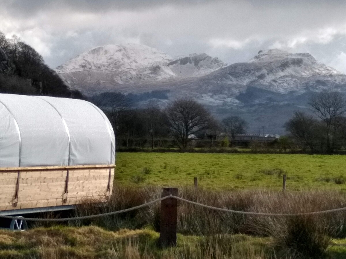 Open all year round/cosy wagons with snow covered Moelwyn Mawr and Moelwyn Bach